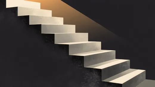 A stone staircase ascending into warm light