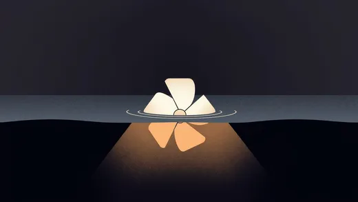A glowing turbine half-submerged at a dark waterline