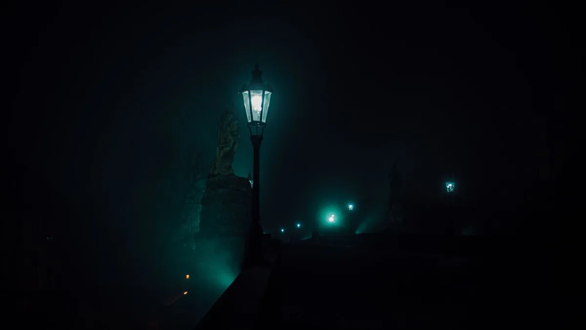 Enchanting night view with street lamps on Charles Bridge, Prague.
