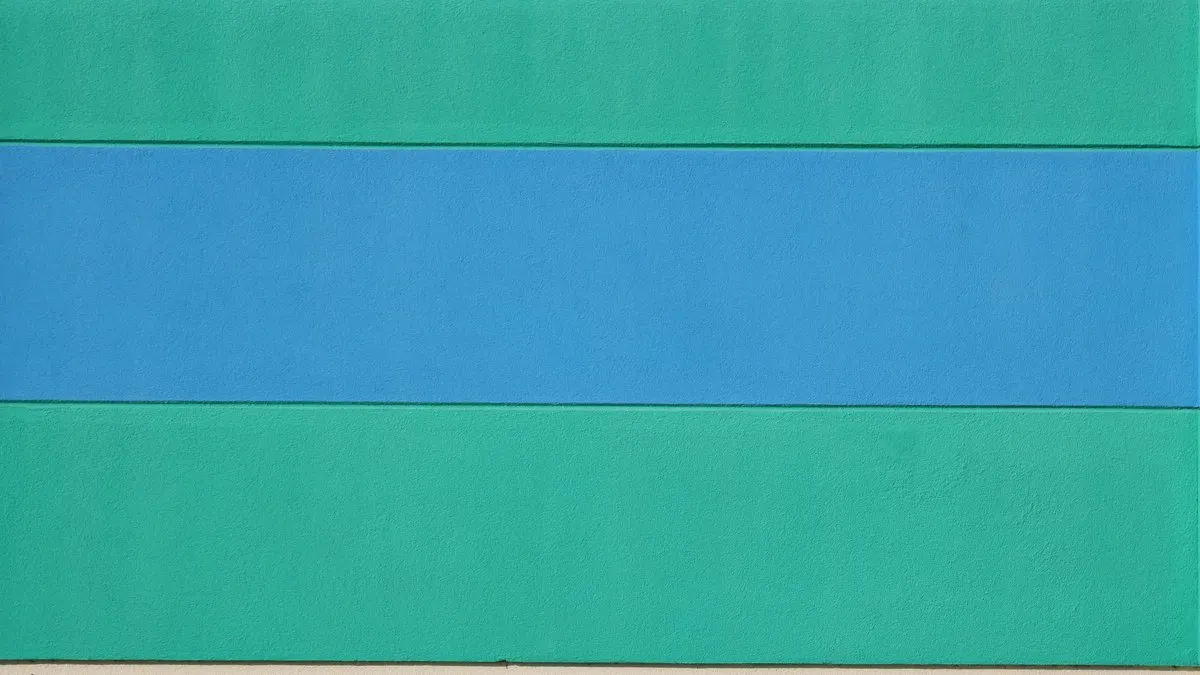 Colorful abstract wall art featuring teal and blue stripes on a beige background.