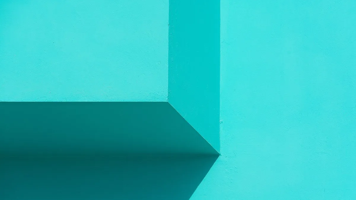 Minimalist abstract image featuring geometric shapes in vibrant turquoise hues.