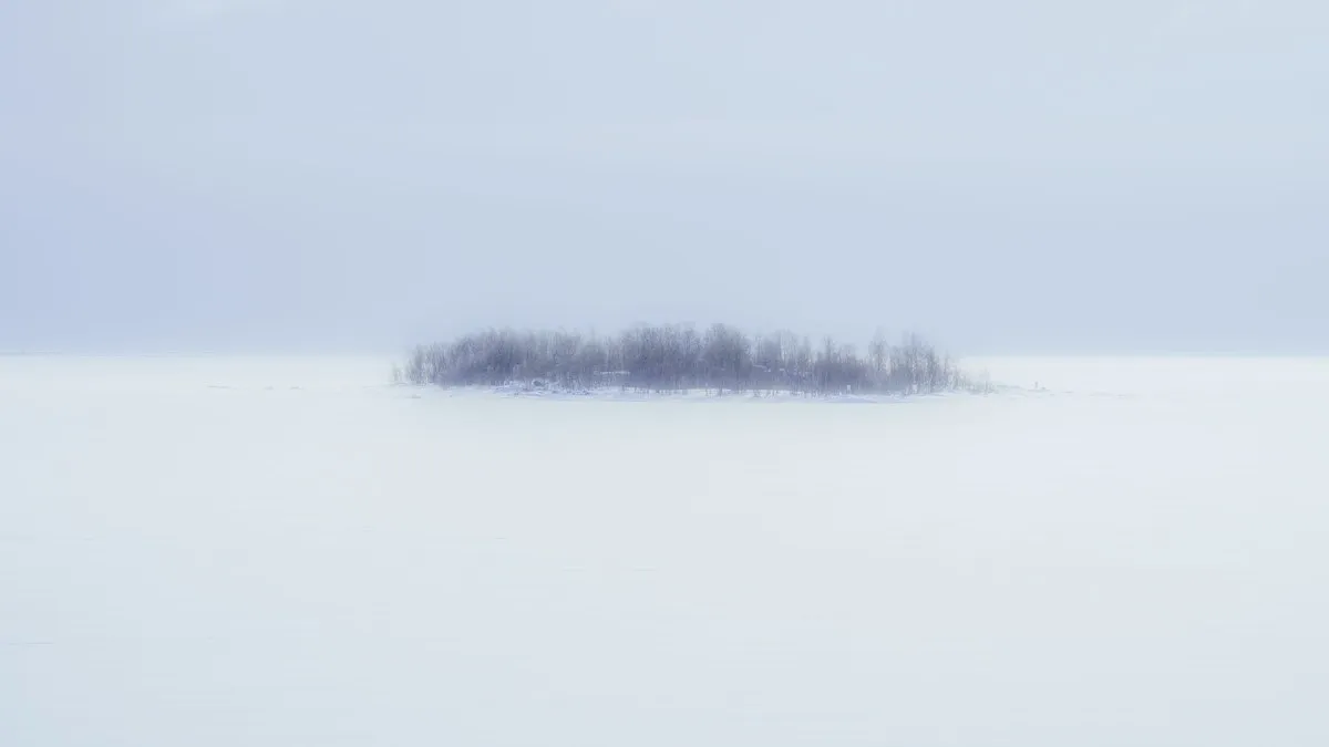 A minimalist winter scene of a snowy island in Kemi, Lapland, Finland.