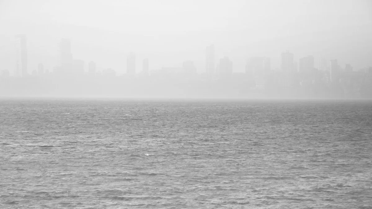 A foggy view of Mumbai's skyline seen across the Arabian Sea.